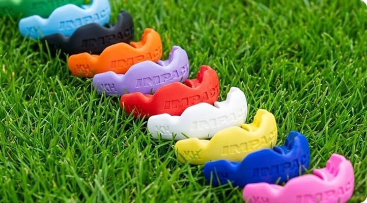 Colourful IMPACT 3D-printed gumshields on grass