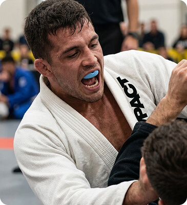 Athlete wearing an IMPACT gumshield during a jiu-jitsu bout